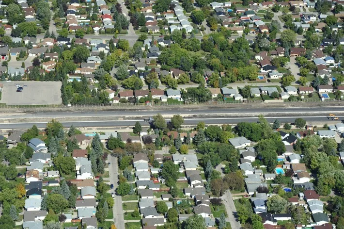 Aerial view showing construction path through neighbourhood